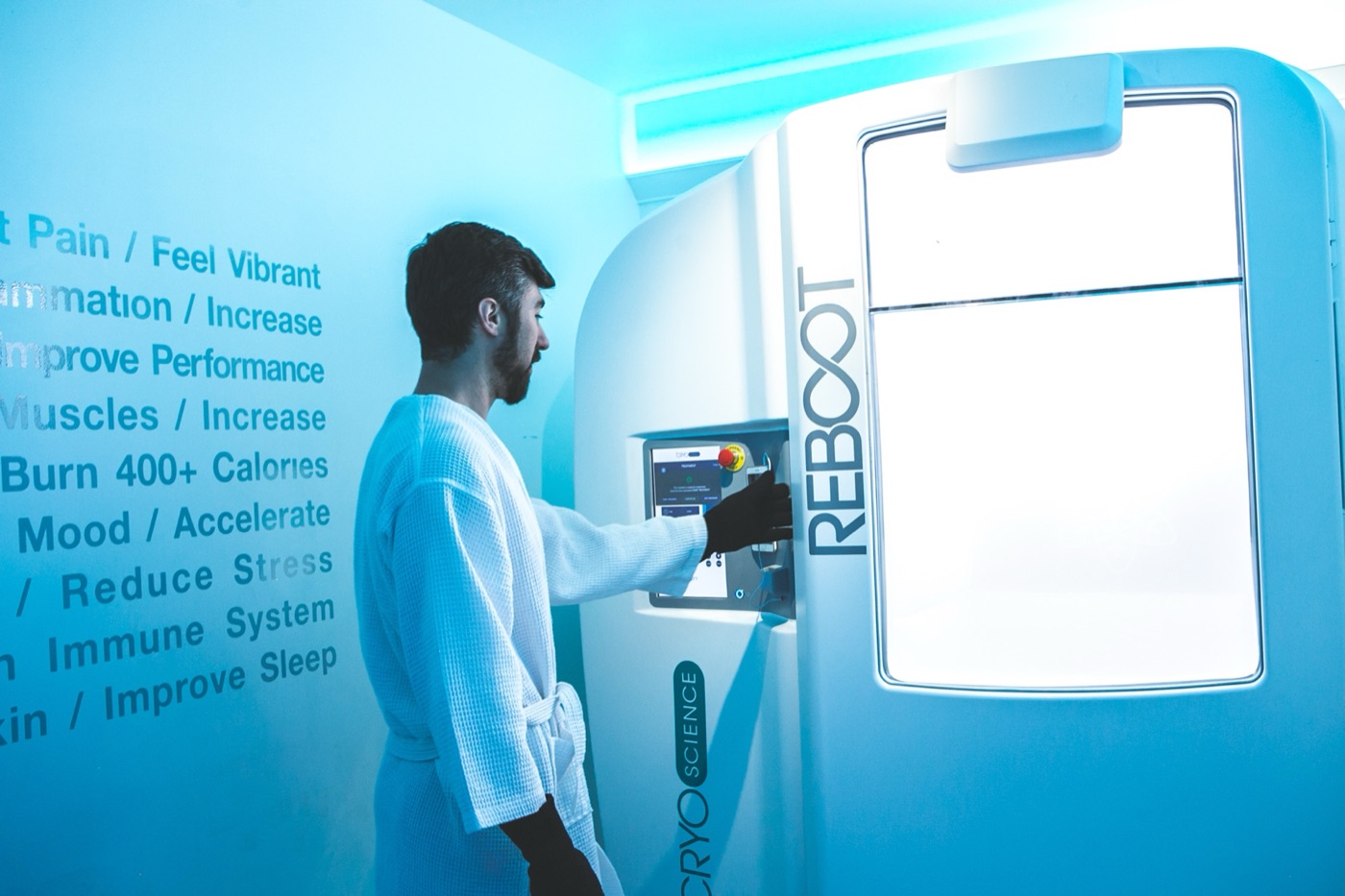 Guest getting set up for a whole-body cryotherapy session at Reboot